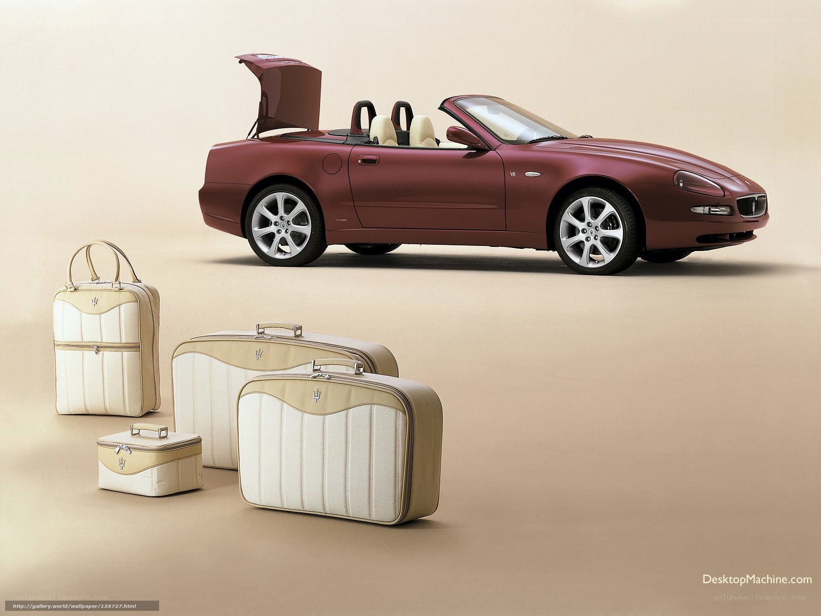 Maserati convertible with luggage set