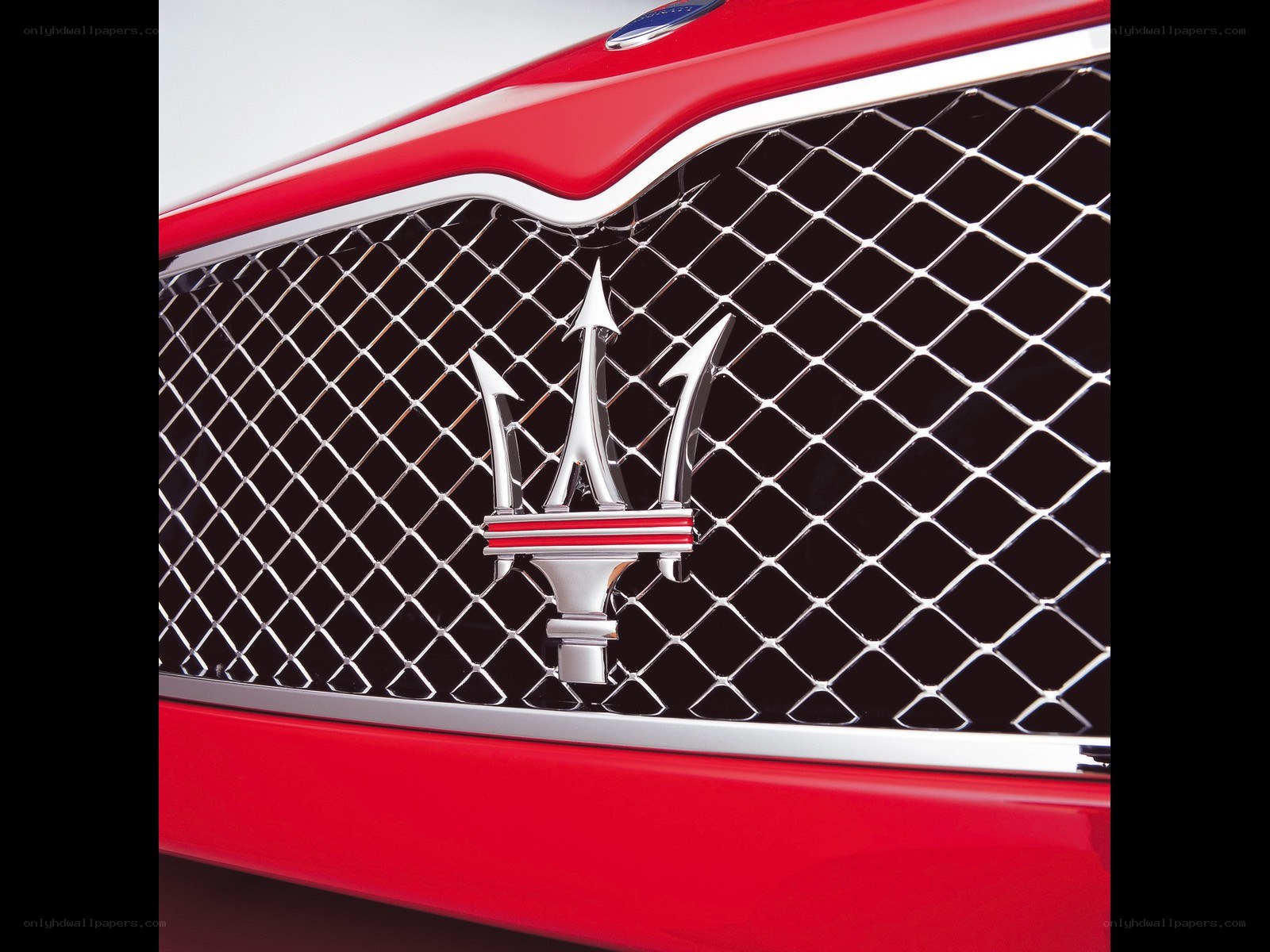 Maserati emblem on red car