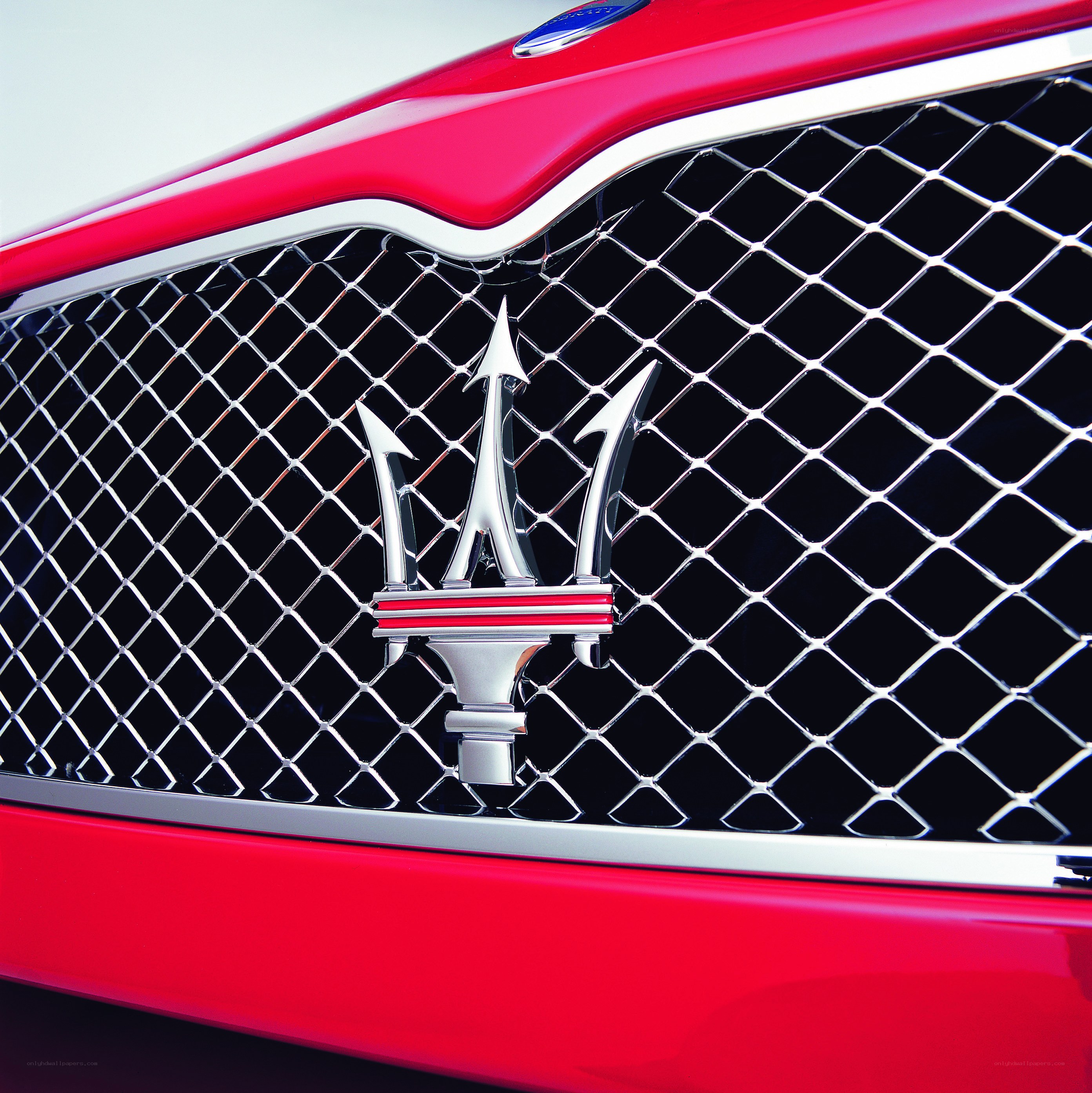 Maserati emblem on red car