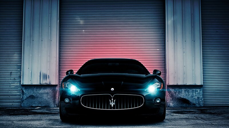 Maserati in front of garage