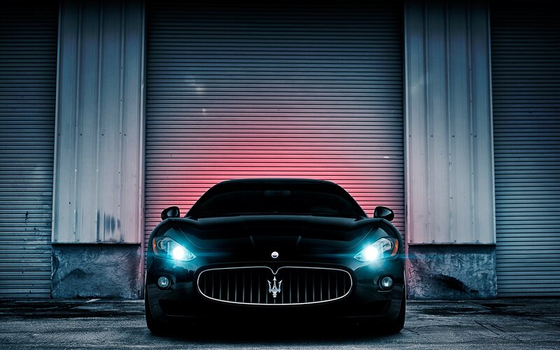 Maserati in front of garage