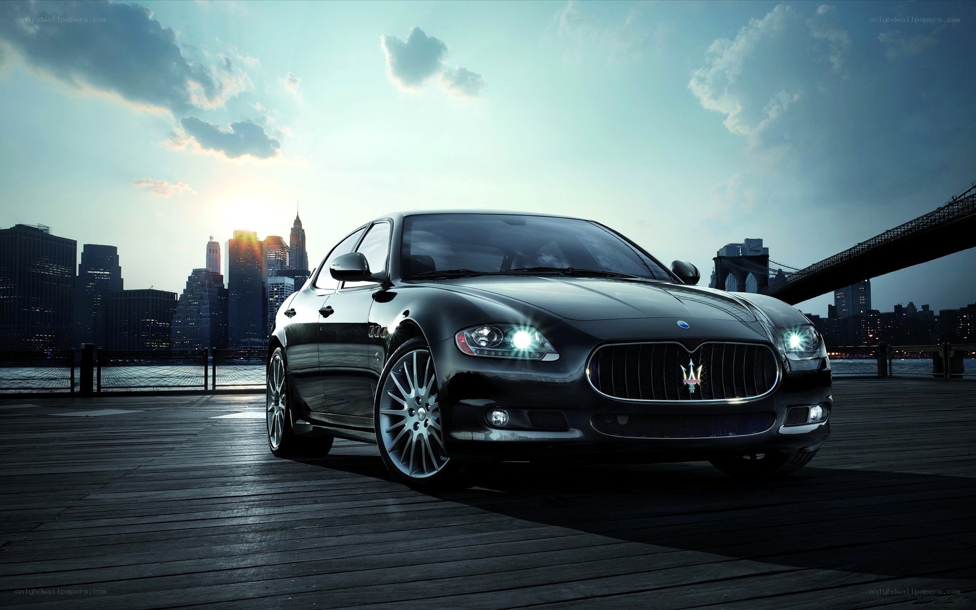 Maserati on a pier at sunset