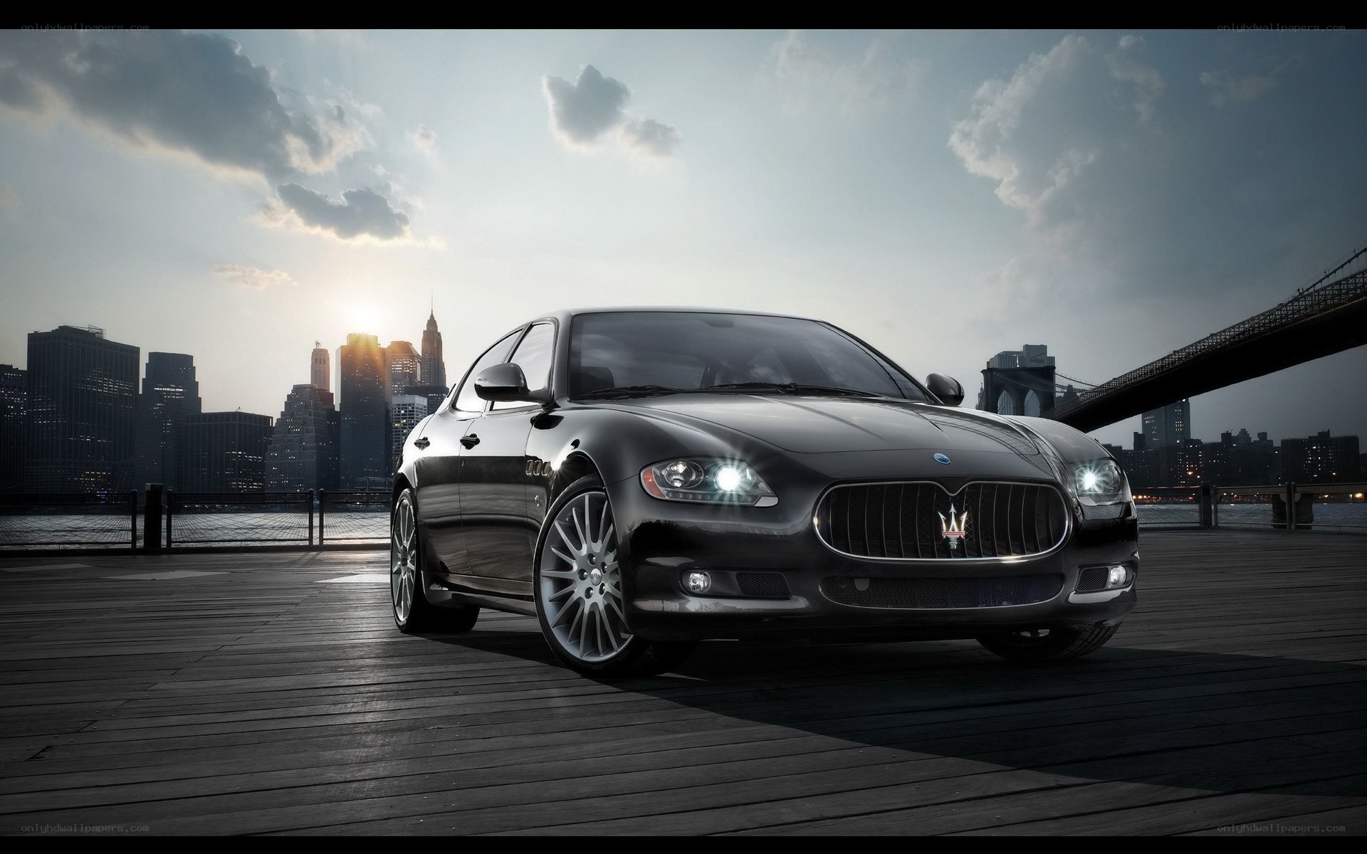 Maserati on a pier at sunset