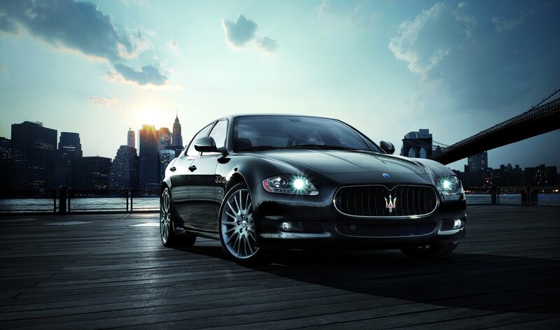 Maserati on a pier at sunset