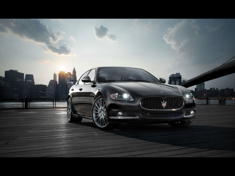 Maserati on a pier at sunset
