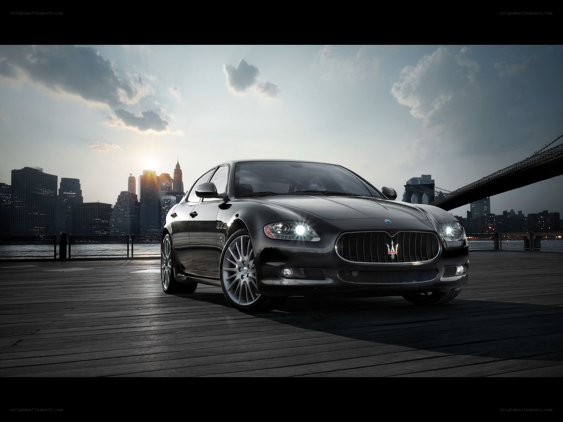 Maserati on a pier at sunset