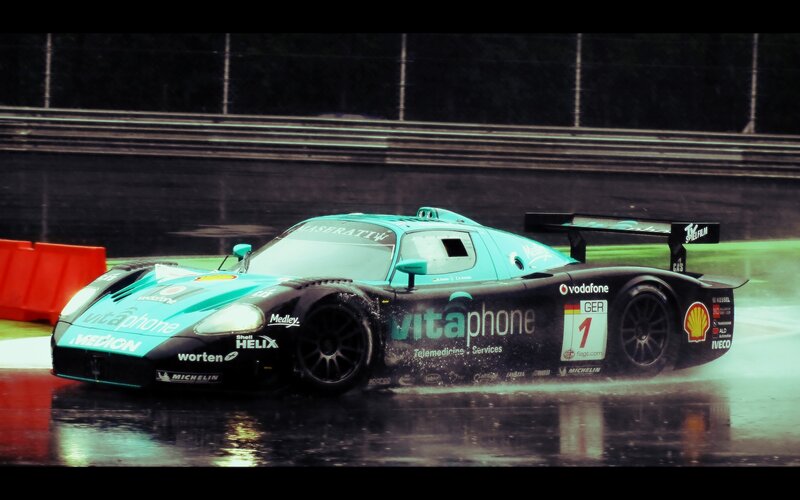 Maserati race car on wet track