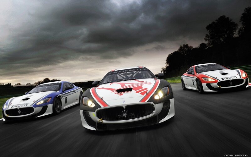 Maserati race cars on track