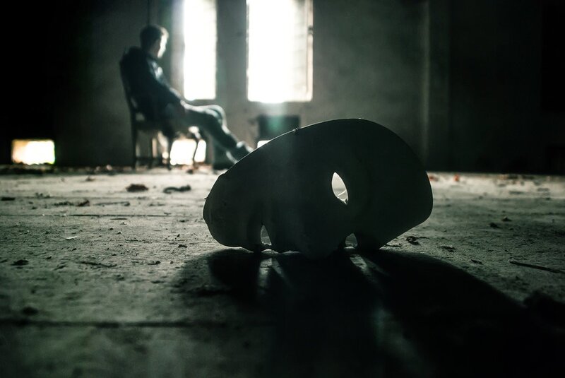 Mask on the floor in a dark room