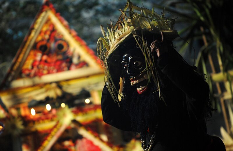 Masked dancer at night festival