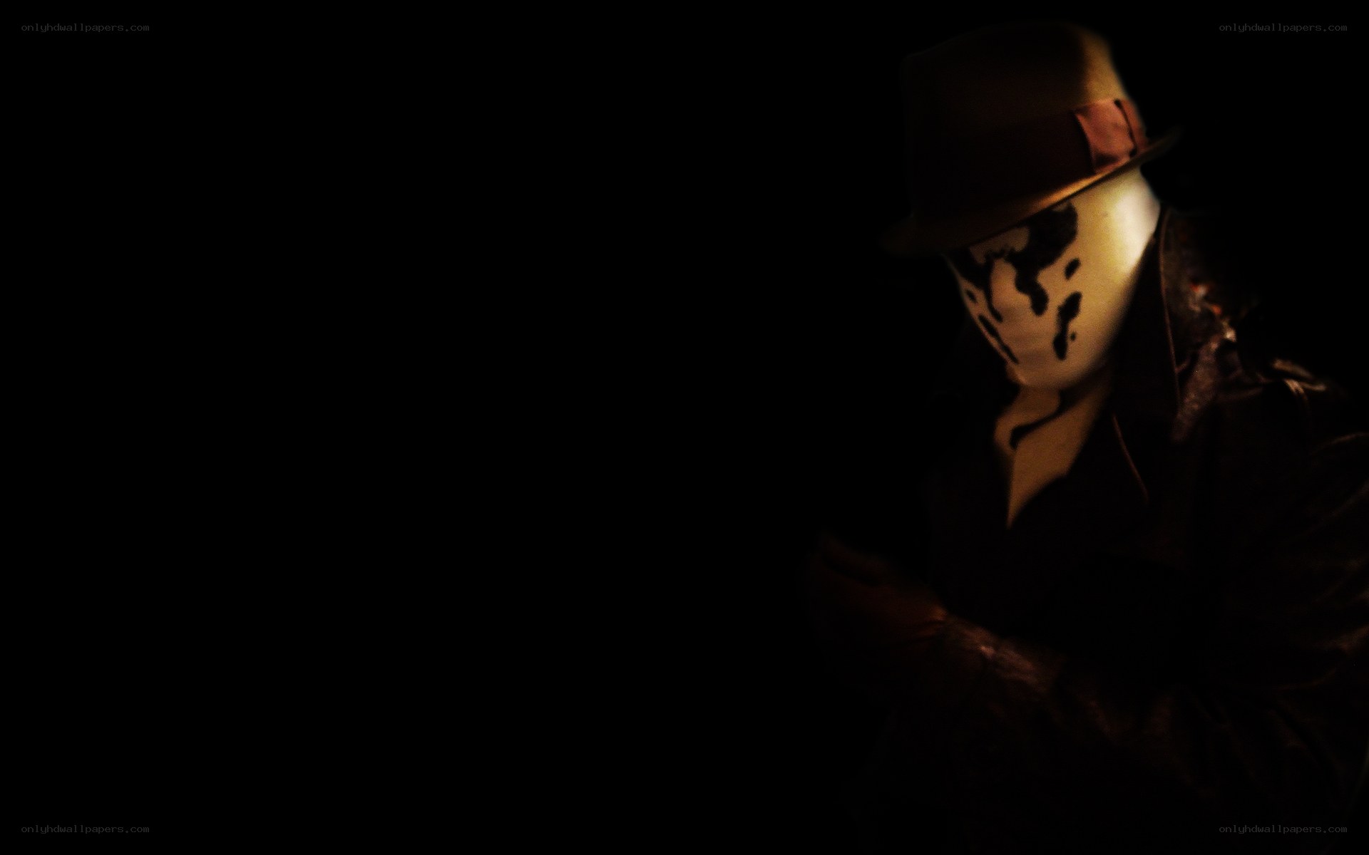masked figure in dark room