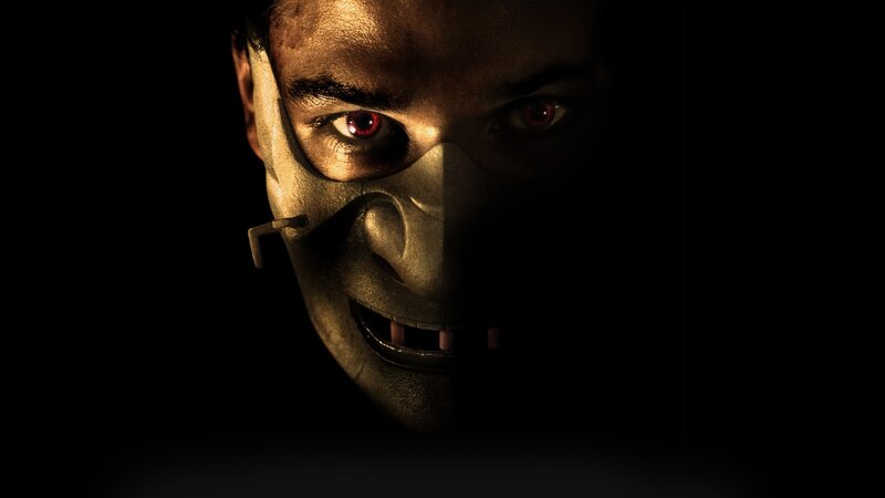 masked figure with red eyes