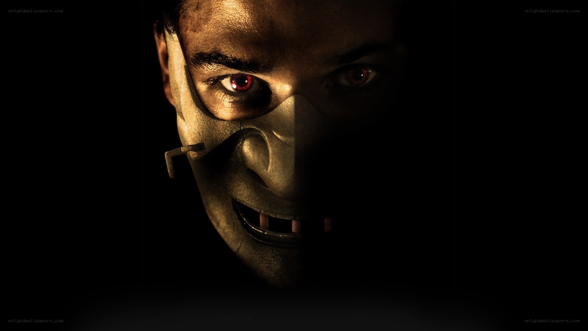 masked figure with red eyes