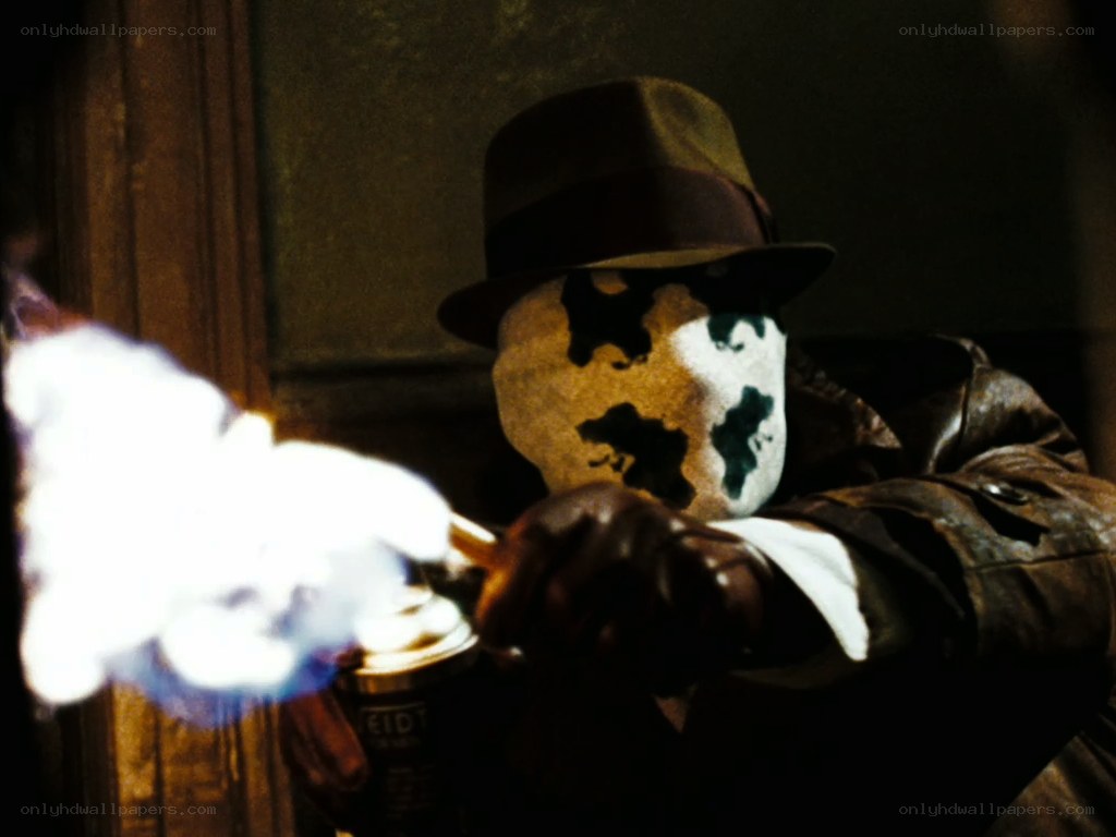 masked figure with spray can