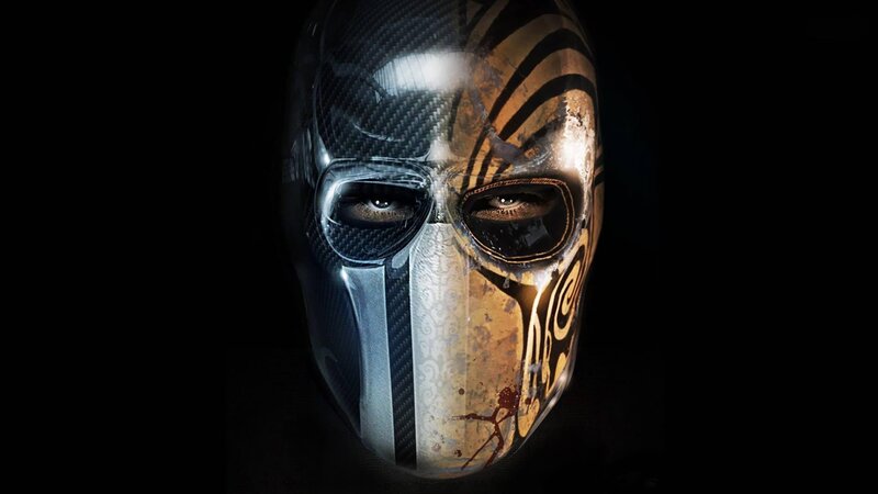 masked figure with tribal mask