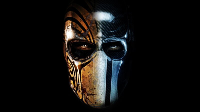 masked figure with tribal mask