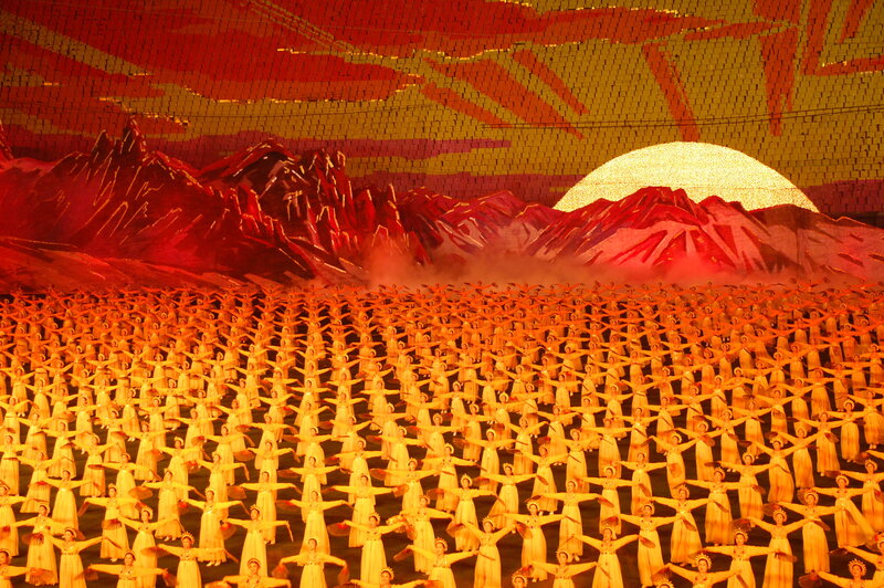 Mass dance performance at sunset