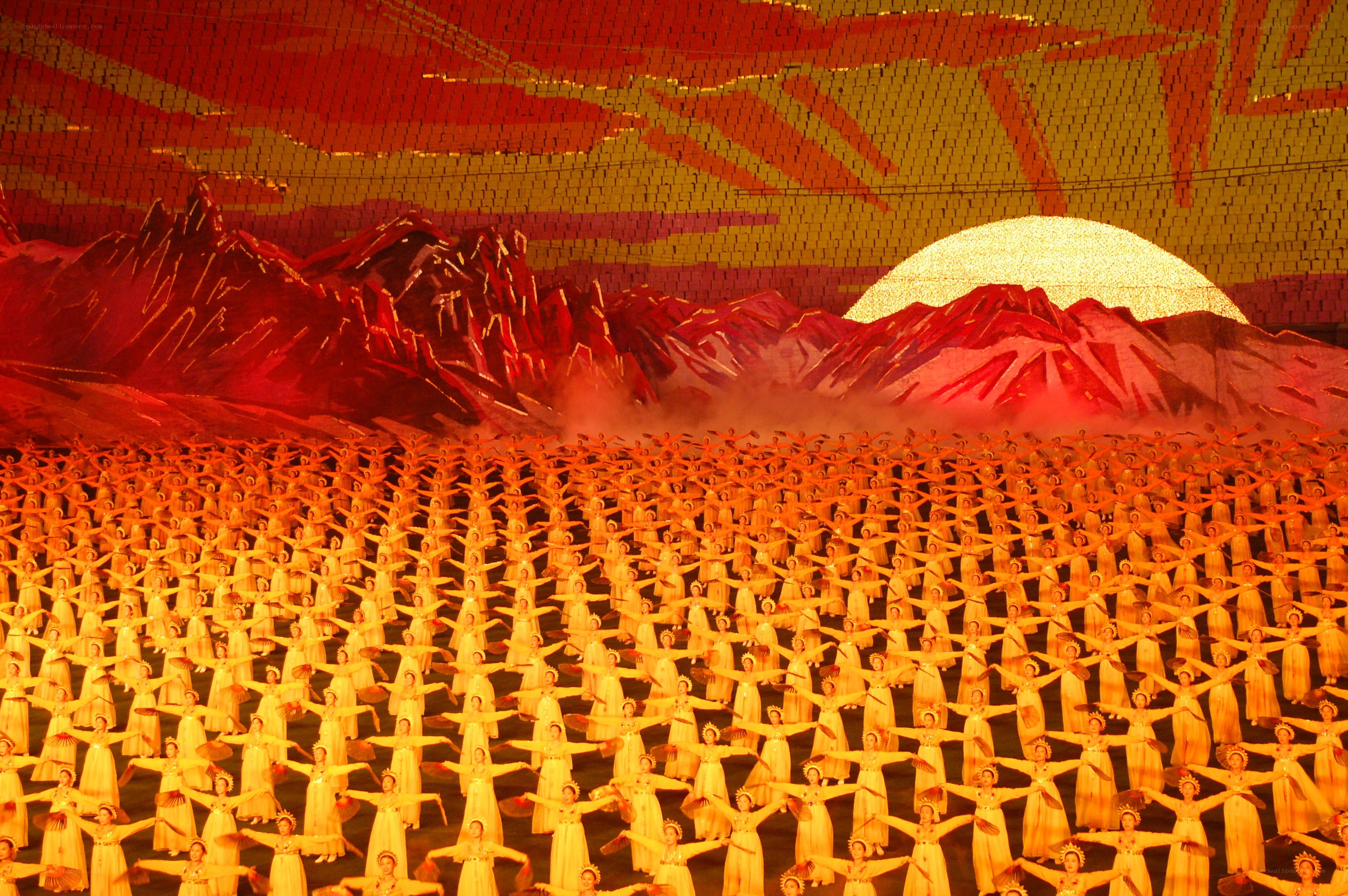 Mass dance performance at sunset