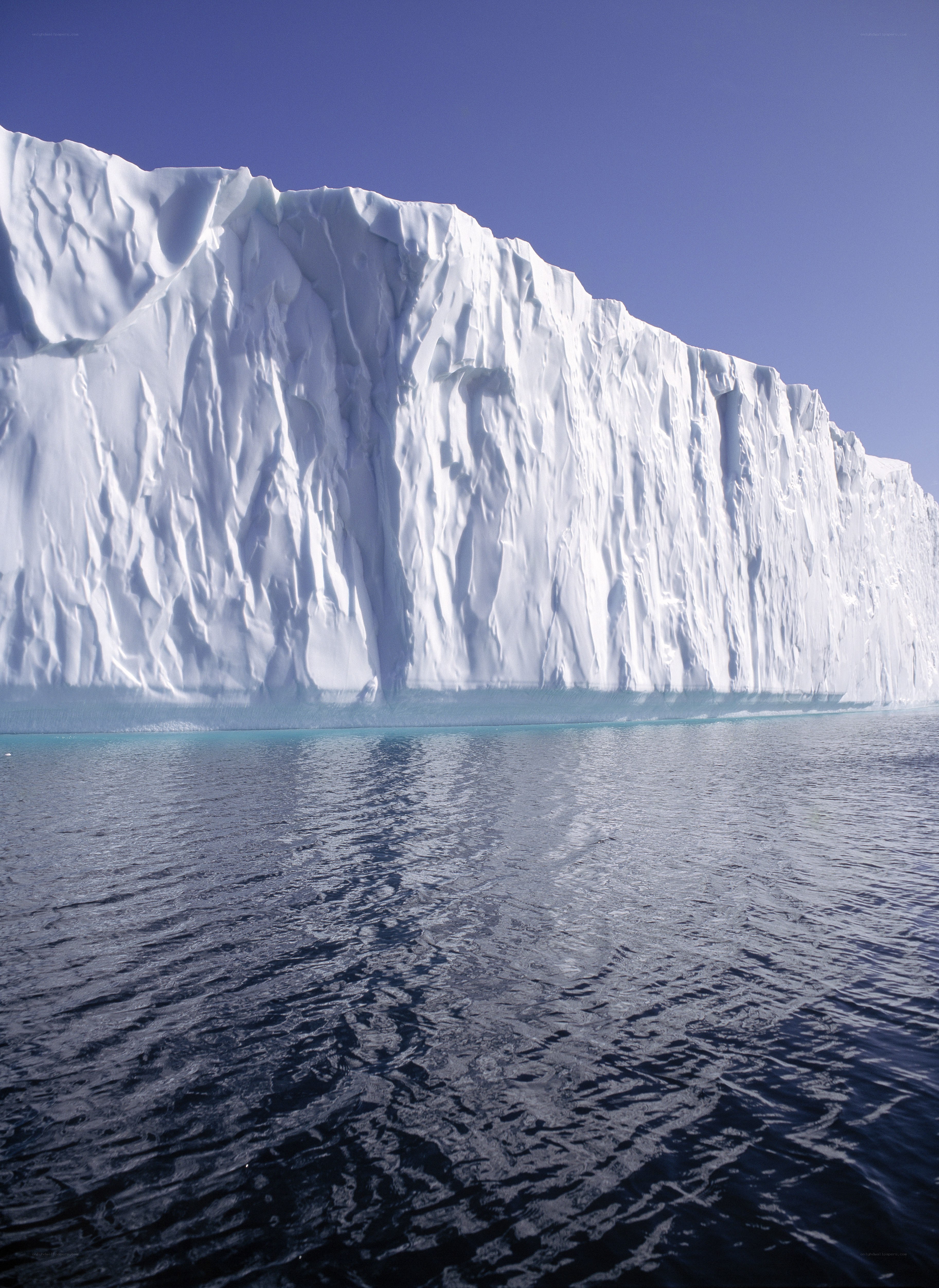 massive iceberg in calm waters