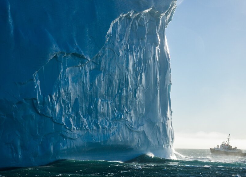 Massive iceberg with ship