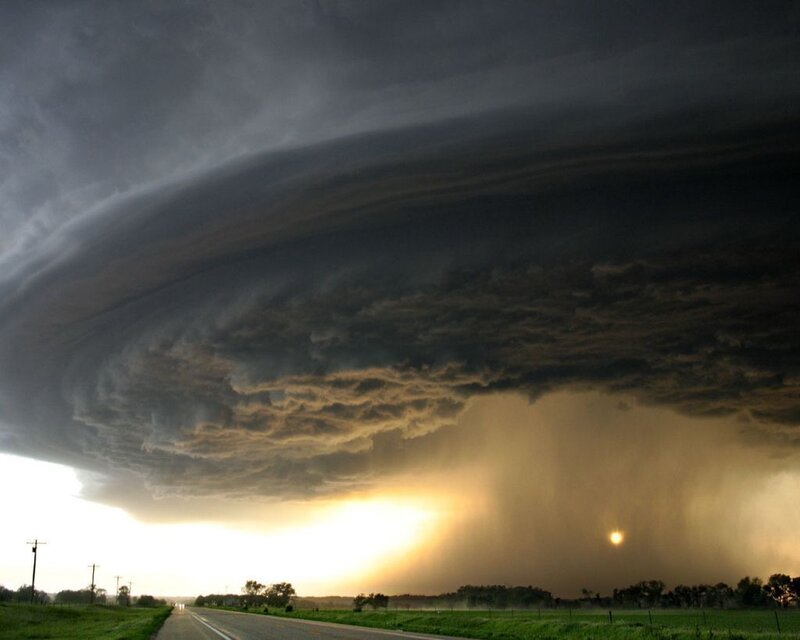 Massive storm cloud over a road