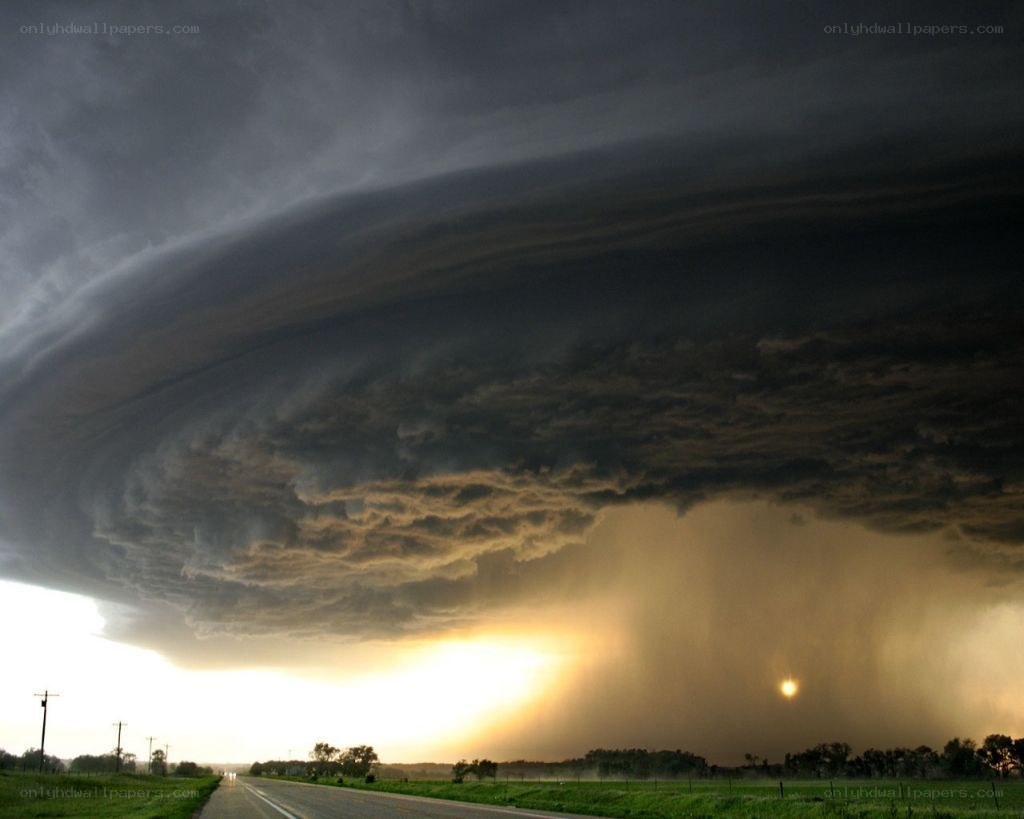 Massive storm cloud over a road
