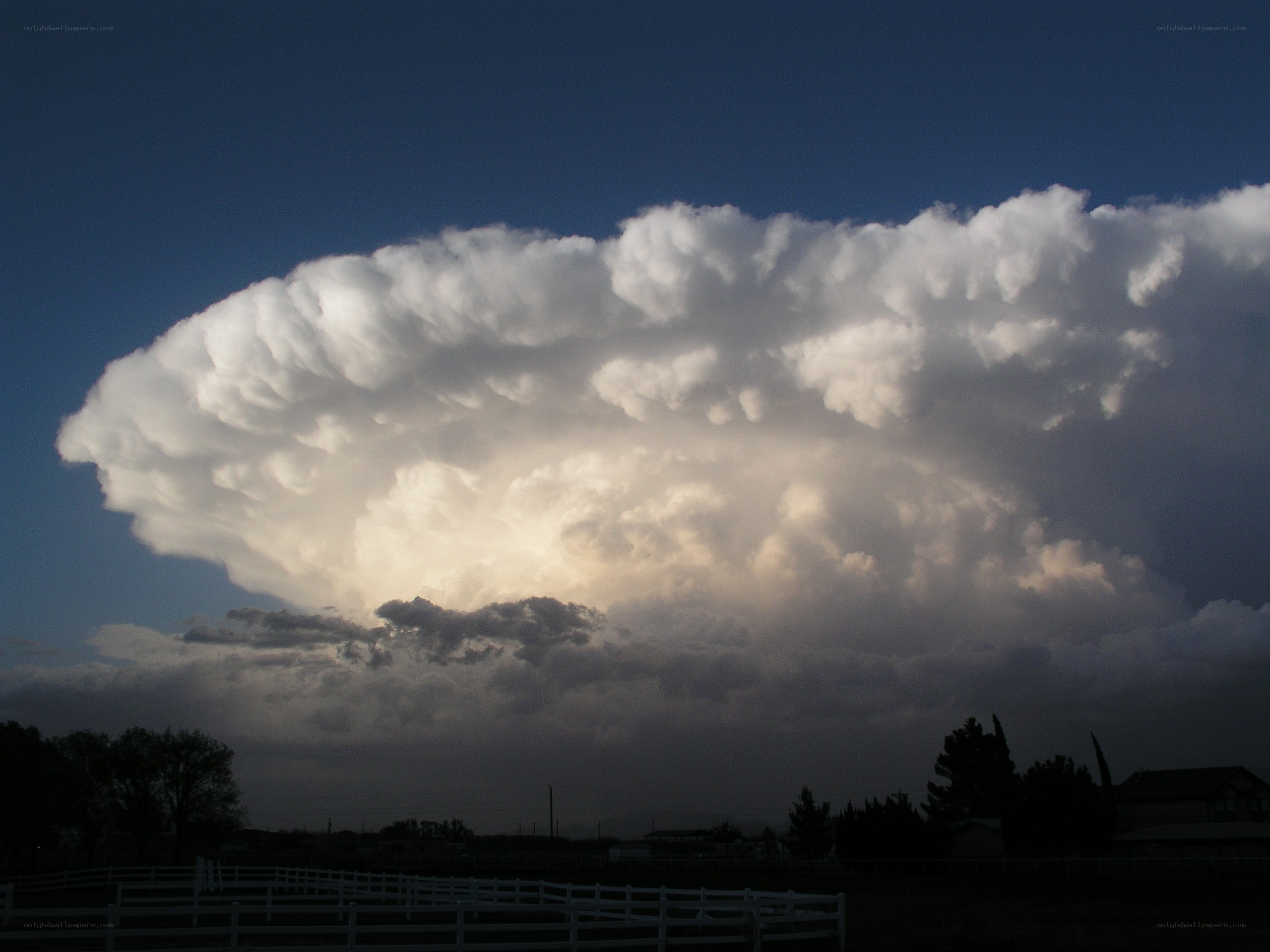 Massive storm cloud over rural area