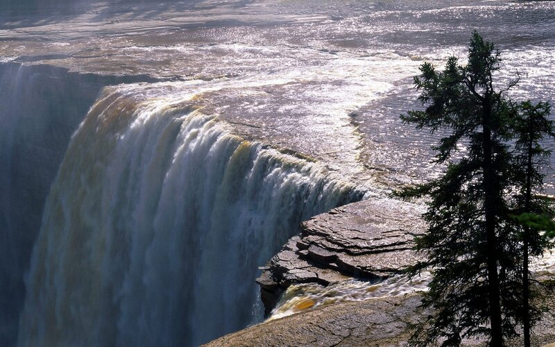 massive waterfall cascading over cliff