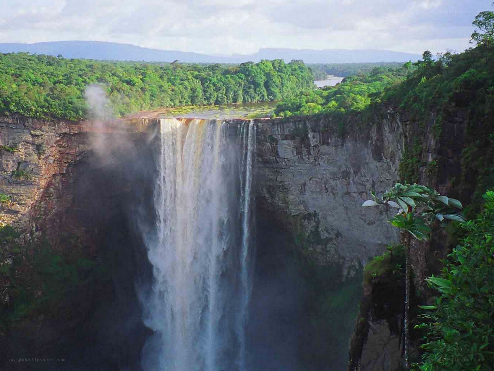 massive waterfall in rainforest