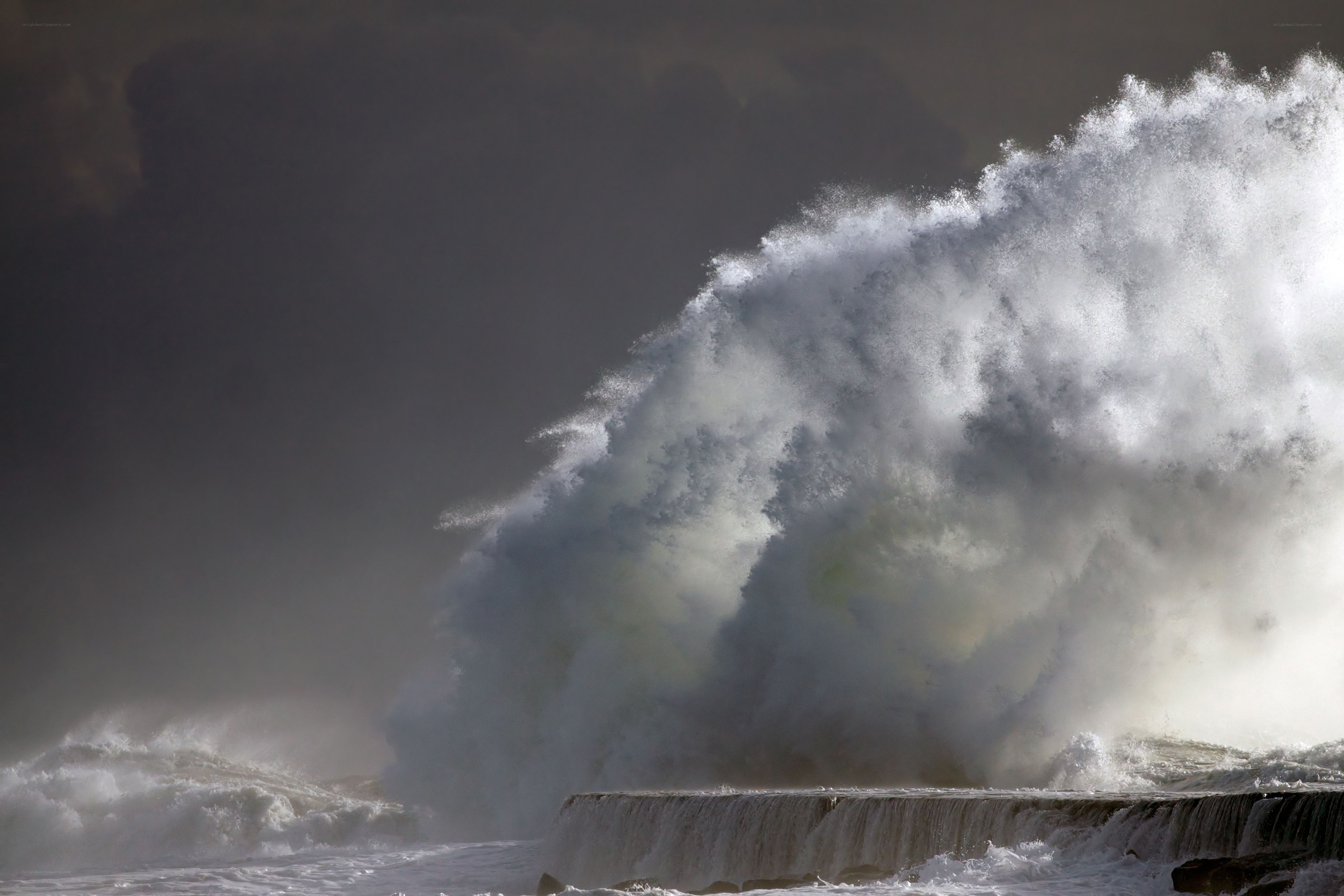 Massive wave crashing on shore