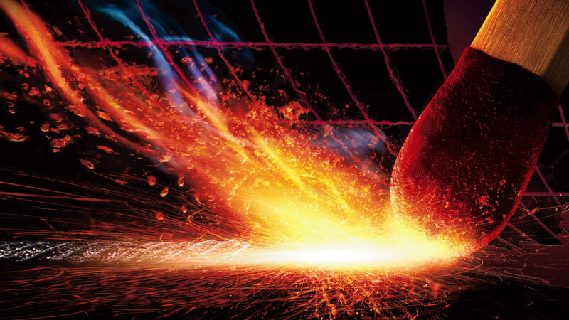 Match igniting with sparks