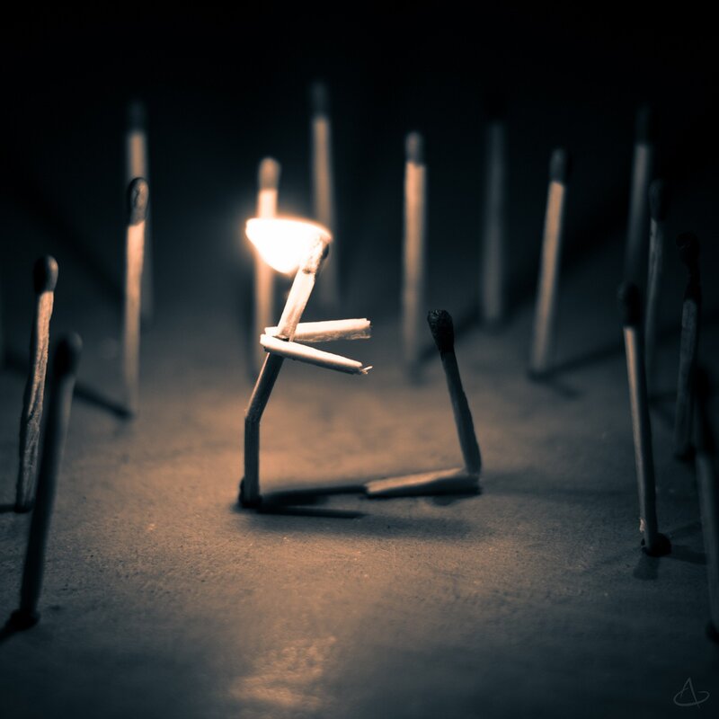 Matchstick figure with flame