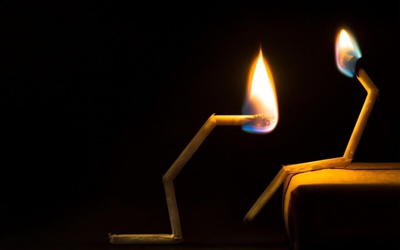 Matchstick figures with flames