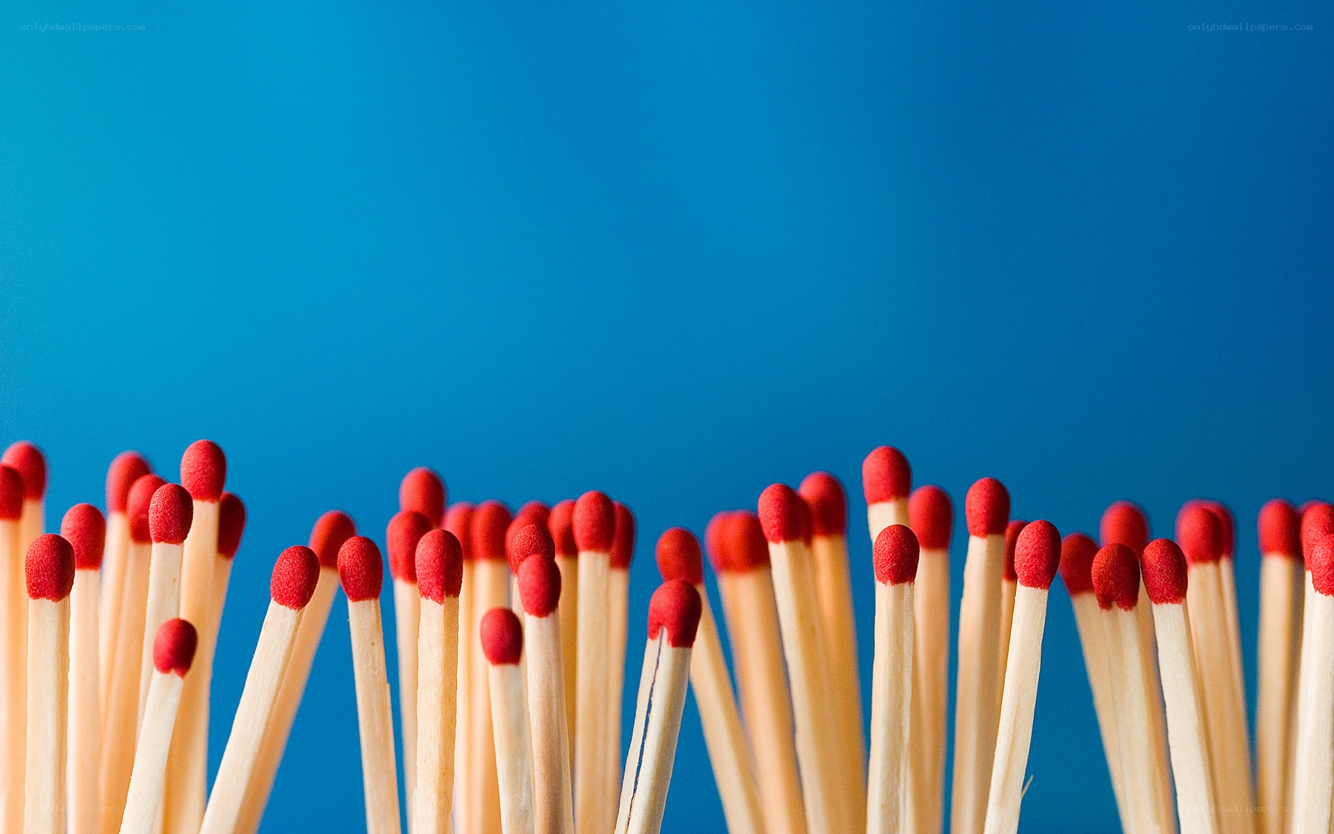 Matchsticks on blue background