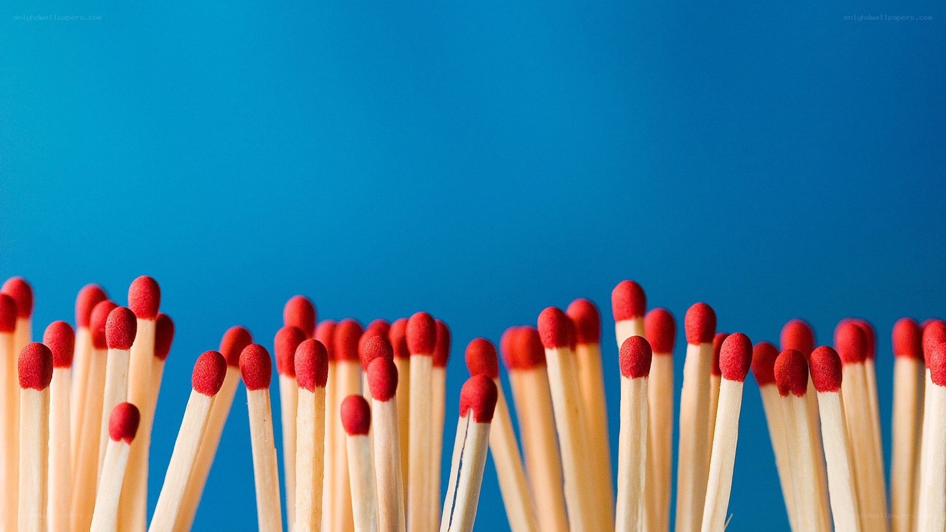 Matchsticks on blue background