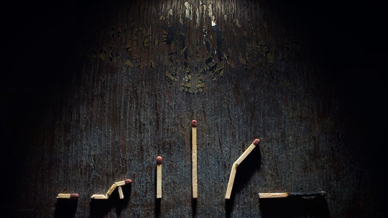 matchsticks on dark wood