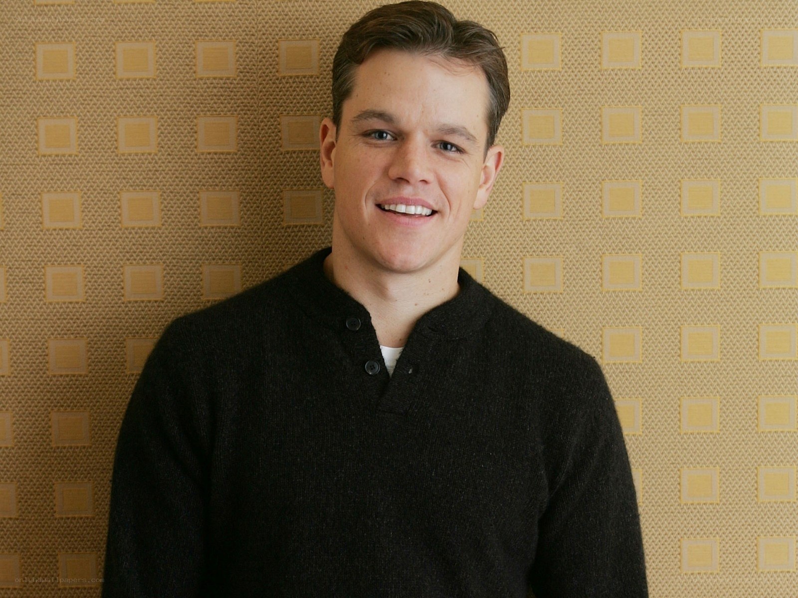 Matt Damon smiling in a sweater