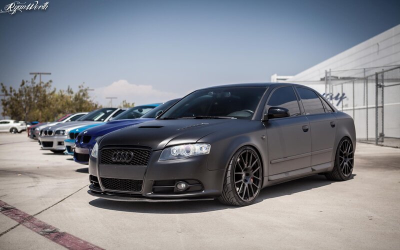 Matte black Audi S4 in a car lineup