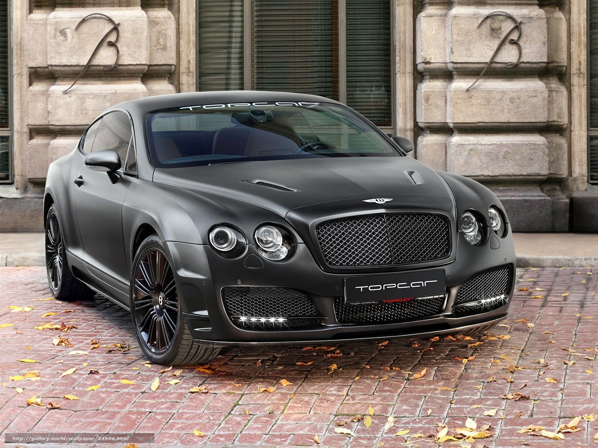 Matte black Bentley parked on cobblestones