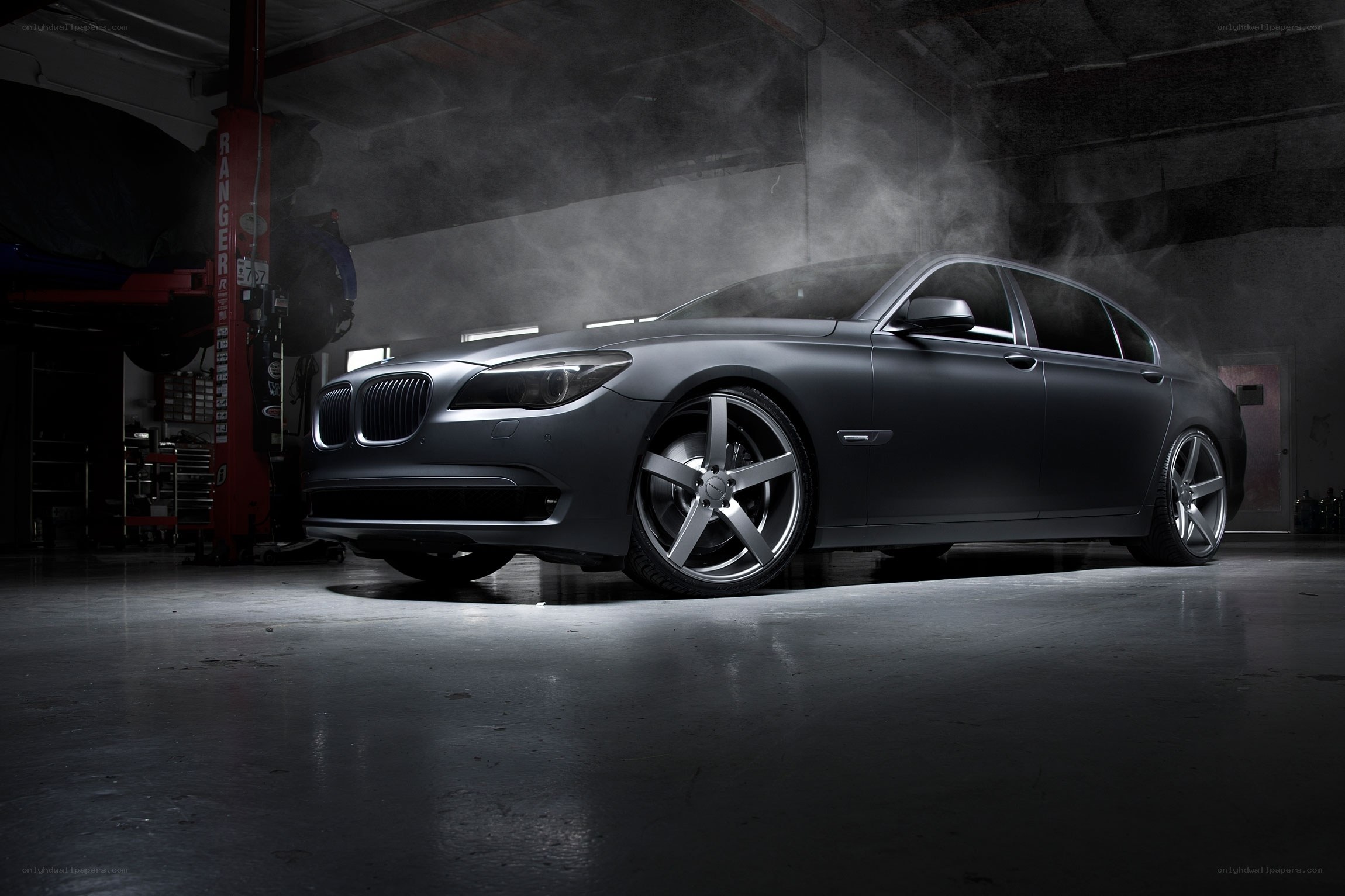 Matte black BMW in garage
