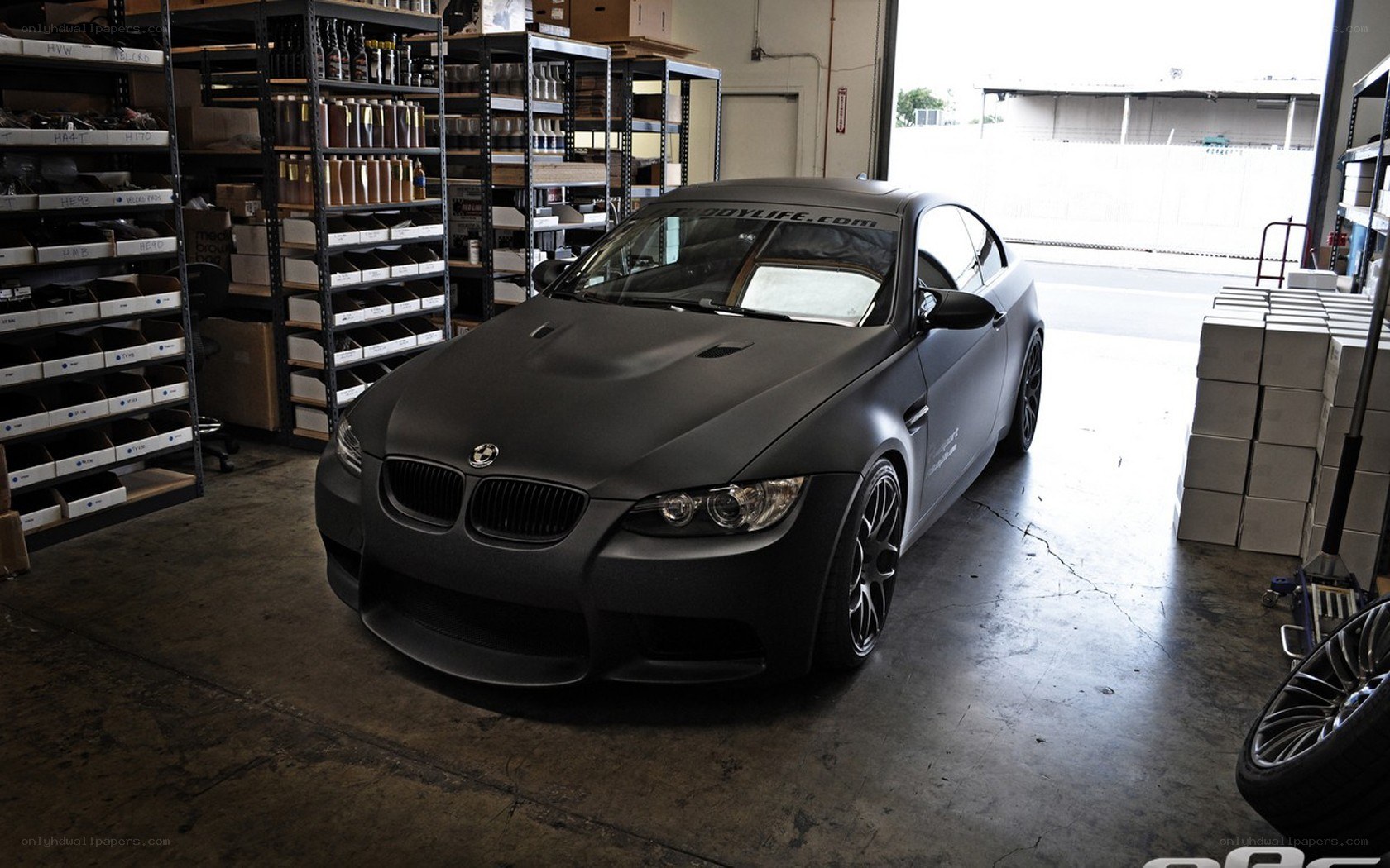 Matte black BMW in garage