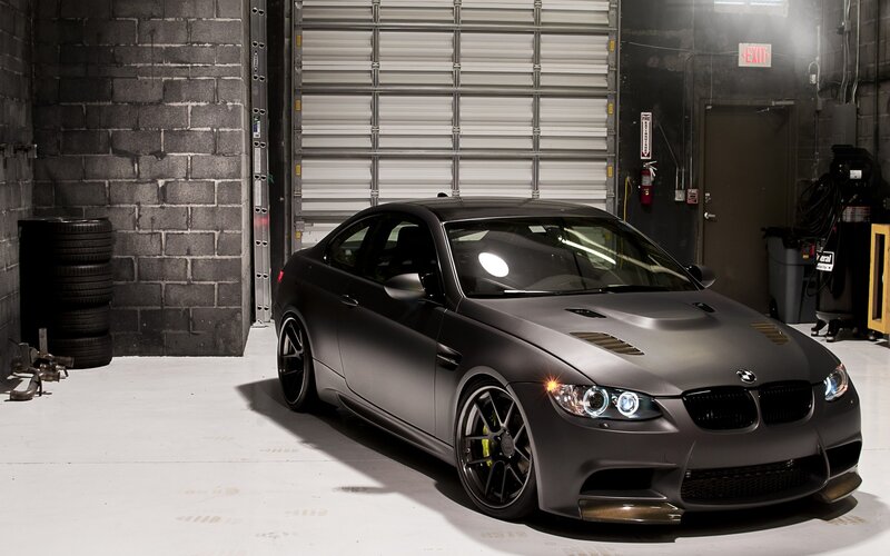 Matte black BMW in garage