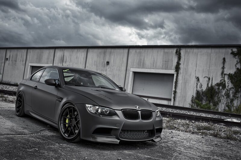 Matte black BMW M3 on gravel