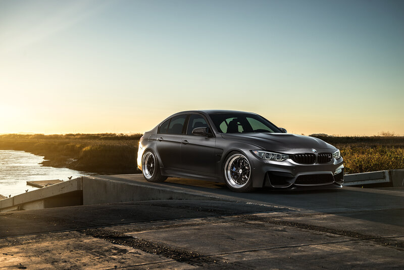 Matte black BMW on concrete ramp