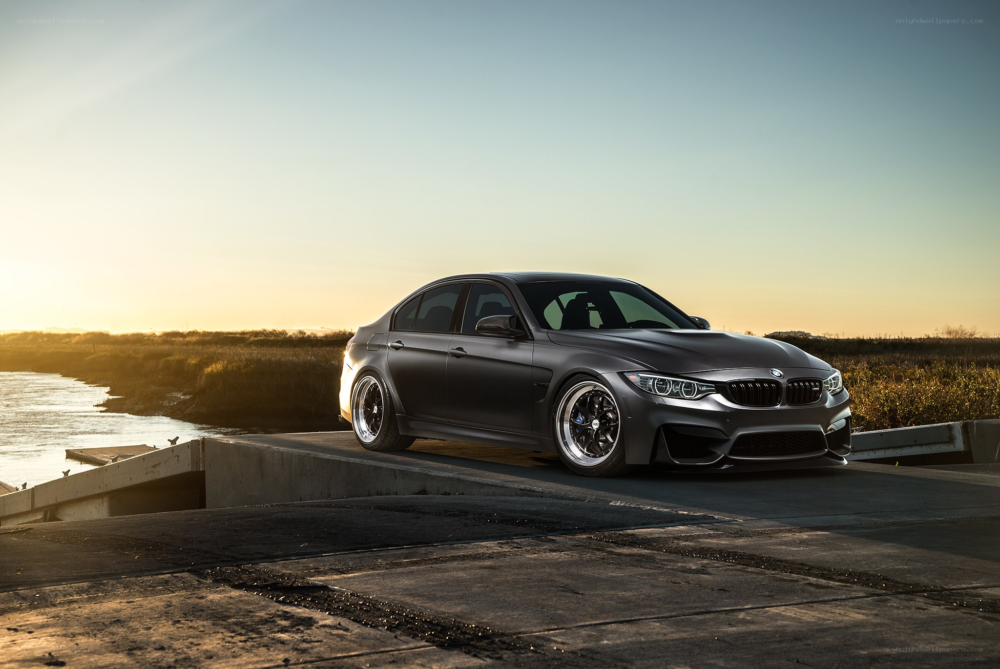 Matte black BMW on concrete ramp