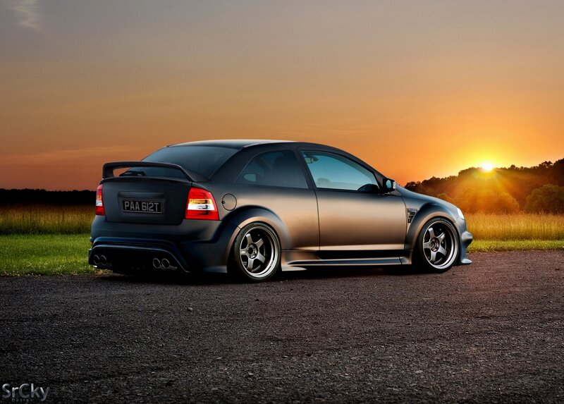 Matte black car at sunset