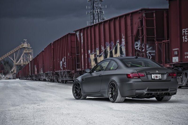 matte black car near train