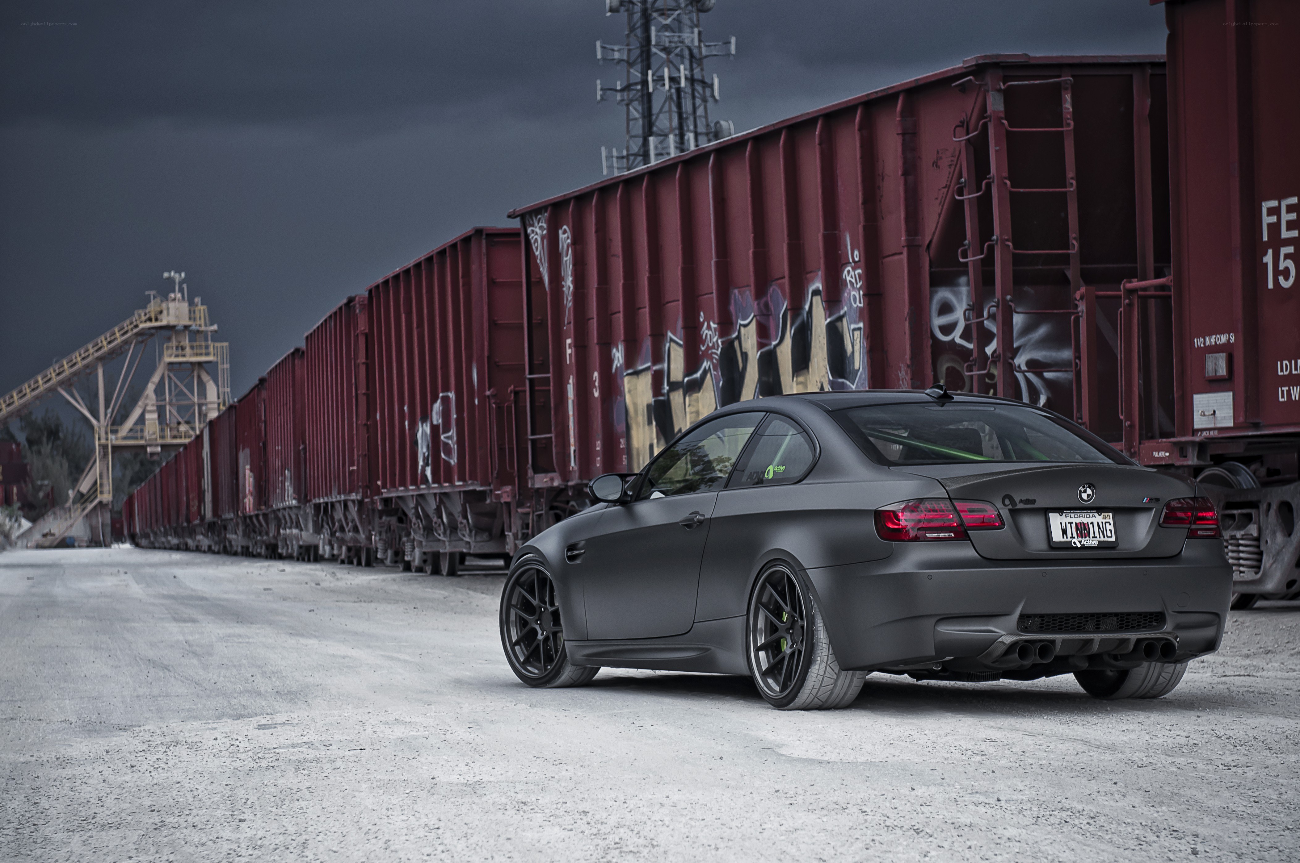 matte black car near train