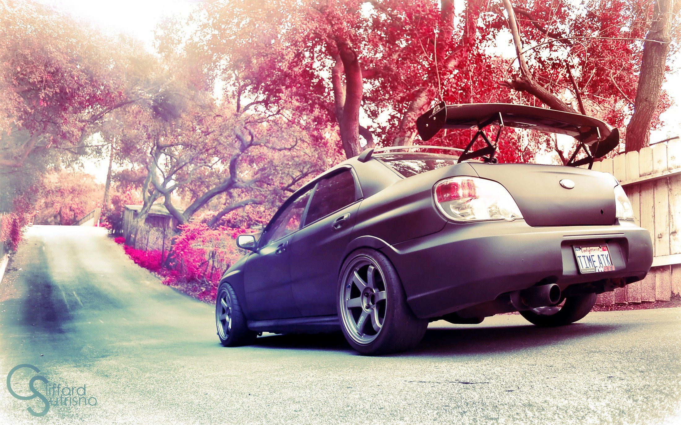 matte black car on a road