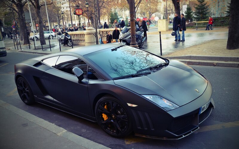 Matte black Lamborghini on city street